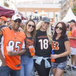 friends smiling at a Cincinnati Bengals tailgate party