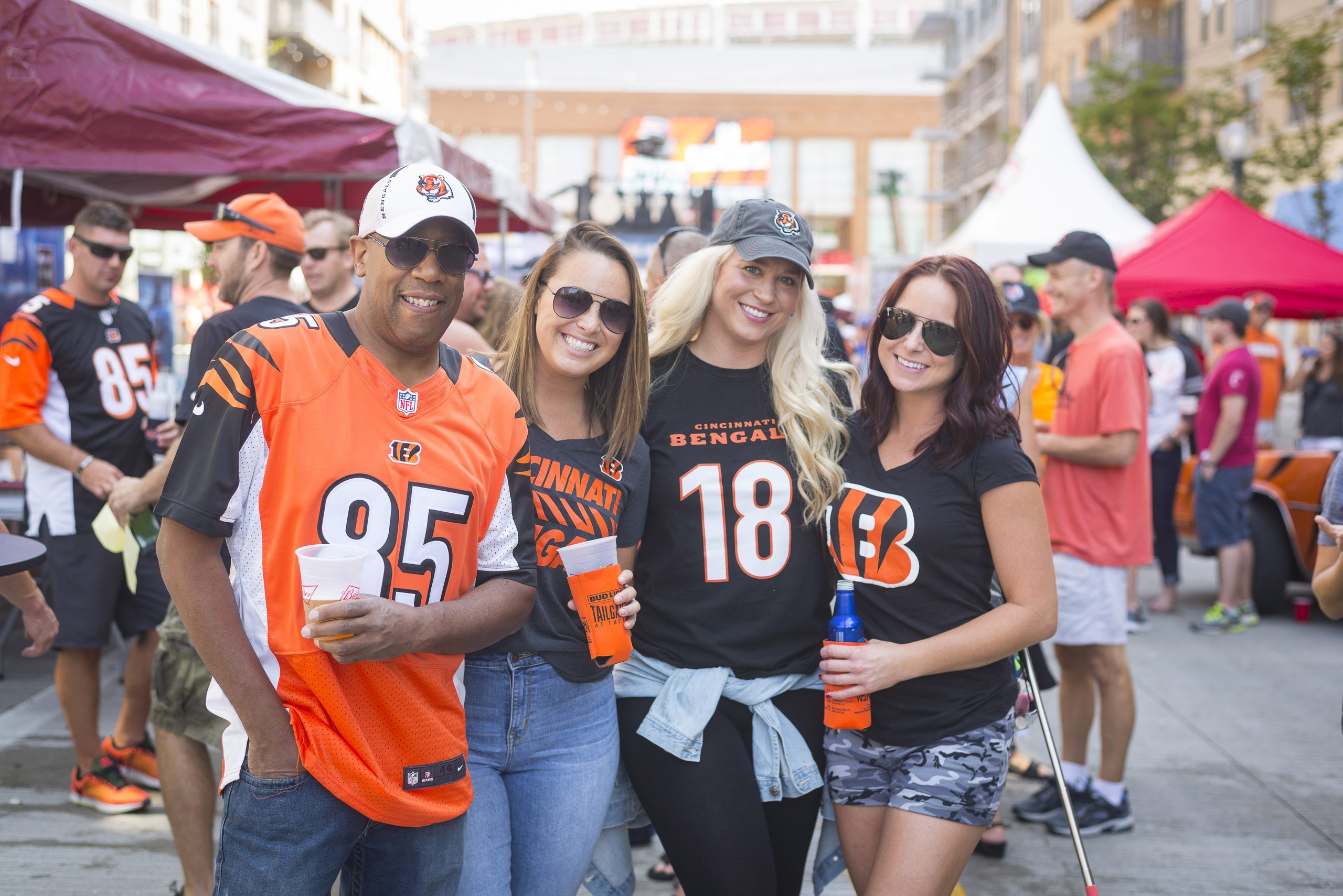 friends smiling at a Cincinnati Bengals tailgate party