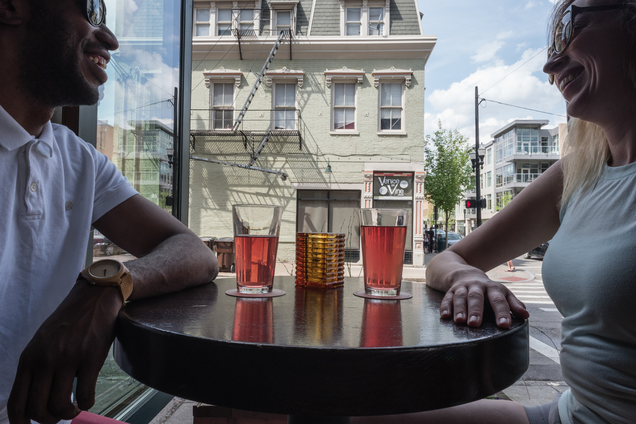 Couple sitting at table outside