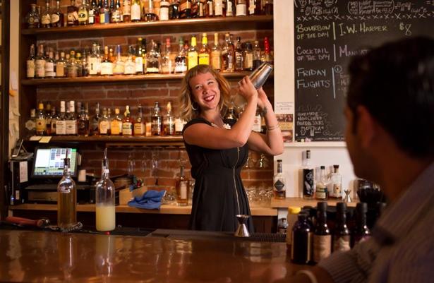 bartender smiling at Old Kentucky Bourbon Bar