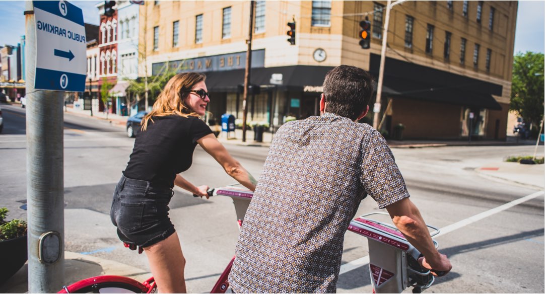 couple riding bikes through Cincinnati