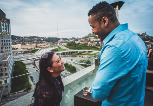 couple laughing at rooftop bar in downtown Cincinnati