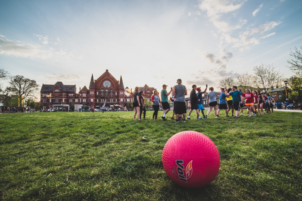 Cincinnati Washington Park kickball teams high fiving