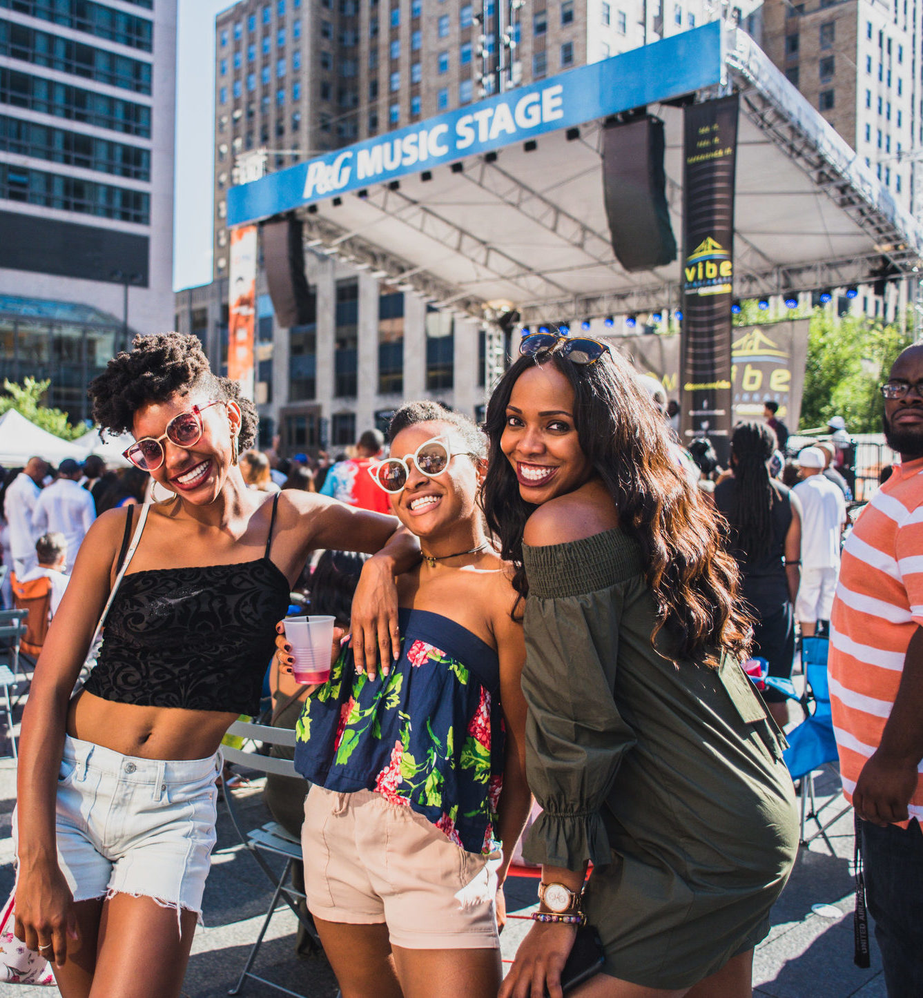 three women smiling at fountain square