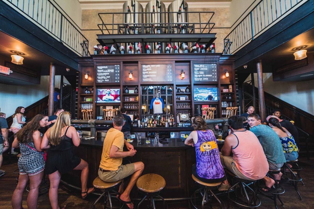 one of the famous cinicnnati drinks spots for young adults sitting is at the bar at Taft's Ale House