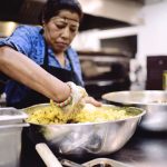 cook in kitchen at Bridges