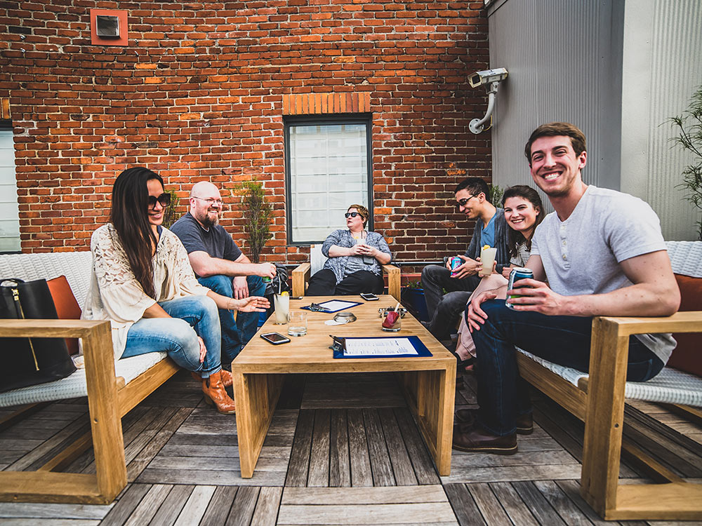 group of people enjoying a drink on 21c Rooftop