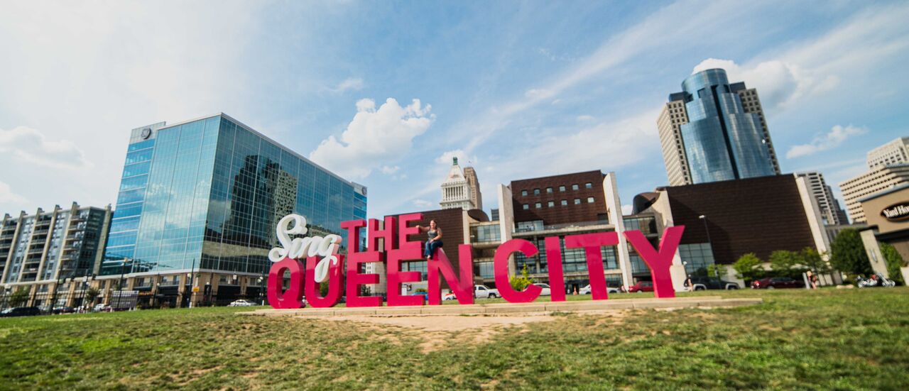 sing the queen city sign that is located in the banks cincinnati